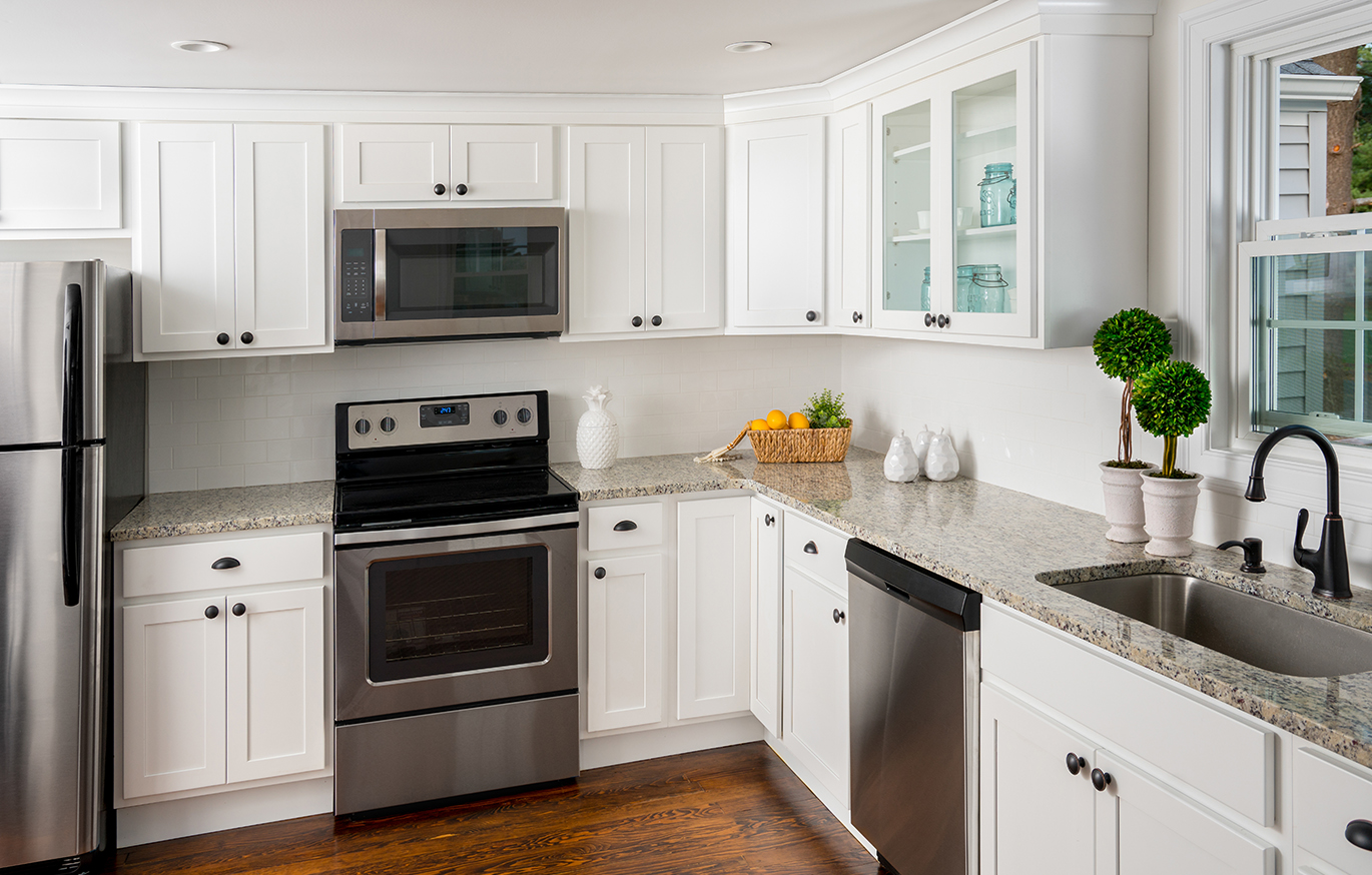Stunning kitchen makeover in Alexandria VA with white cabinetry and modern island