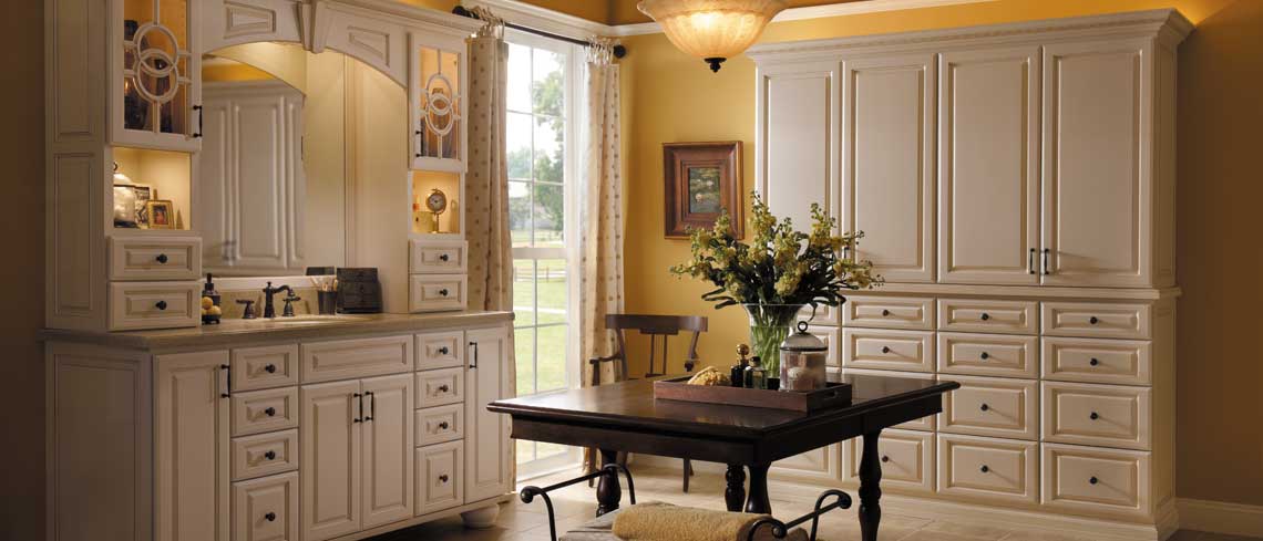 Custom kitchen cabinets with pull-out shelves and soft-close drawers by Optima Kitchen and Bath